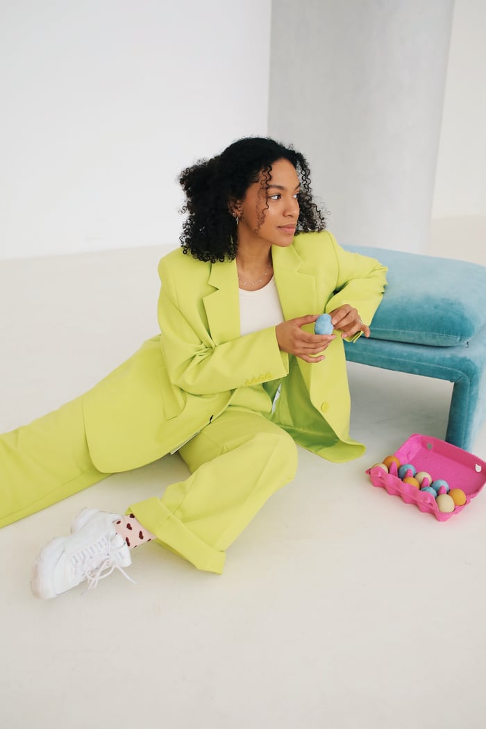 Woman in Bright Green Suit with Easter Eggs